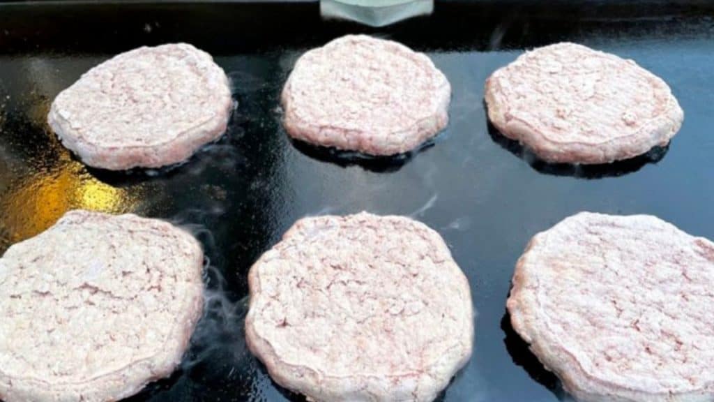 frozen burgers on a blacktone griddle