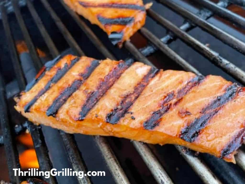 A piece of salmon on the grill