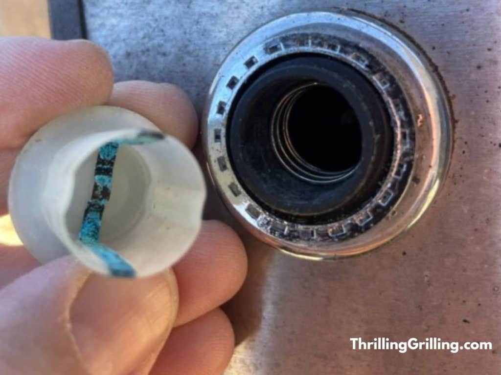 Inside the battery holder of my Weber grill igniter not working because of corrosion.