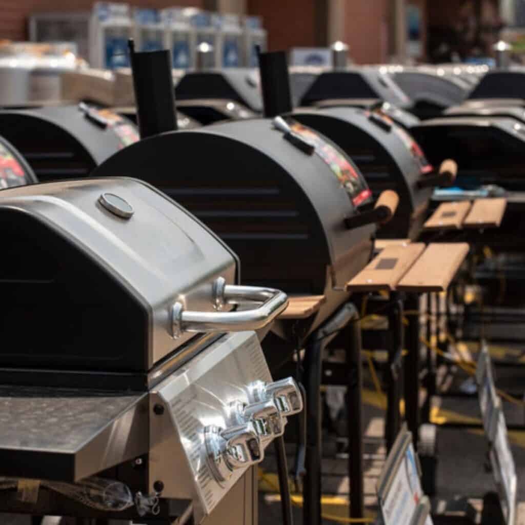 A number of various grills lined up for sale. 